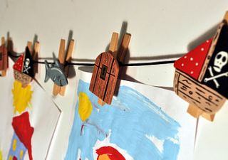 string of wooden pirate pegs by angelic hen