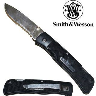 SW 510. 8" Smith & Wesson Folding Knife  Black w/ Silver Blade 8" Smith & Wesson Folding Knife  Black w/ Silver Blade. The knife measures 8" overall with3.5" long silver blade with half serration, :"Smith &Wesson" 